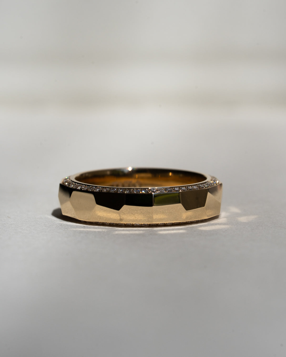Hammered gold band with pavé diamonds