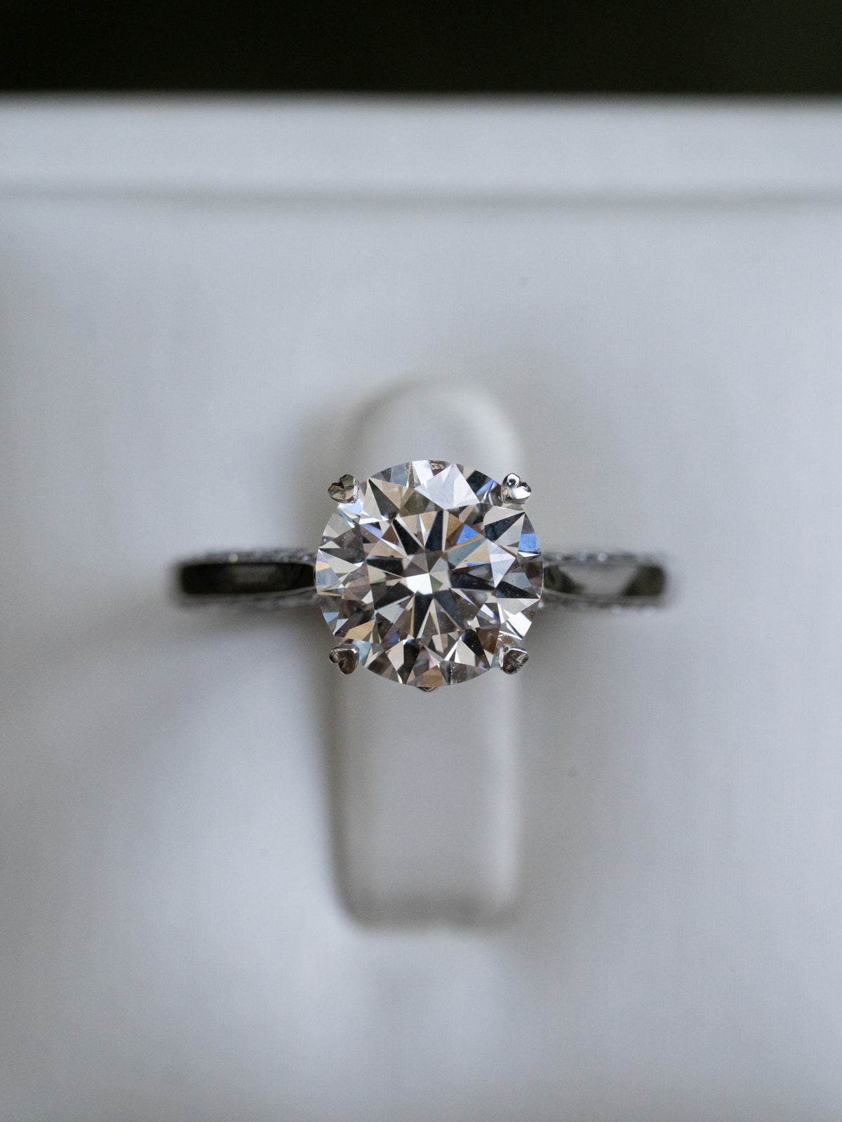 Round Diamond with Hidden Diamonds and Heart Prong Detailing