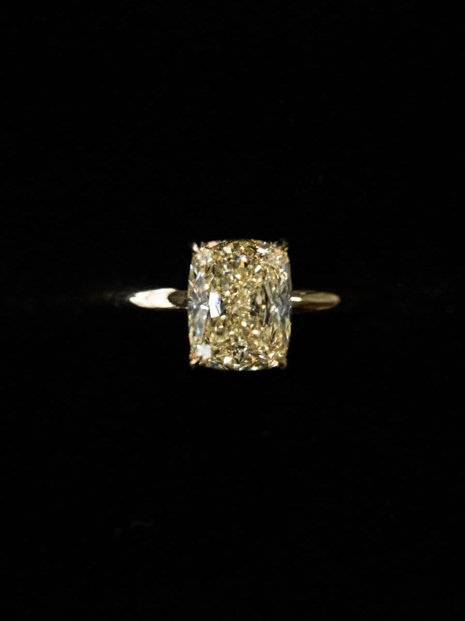 Fancy yellow elongated cushion cut diamond solitaire engagement ring with hidden halo in 18ct yellow gold - custom engagement ring top view