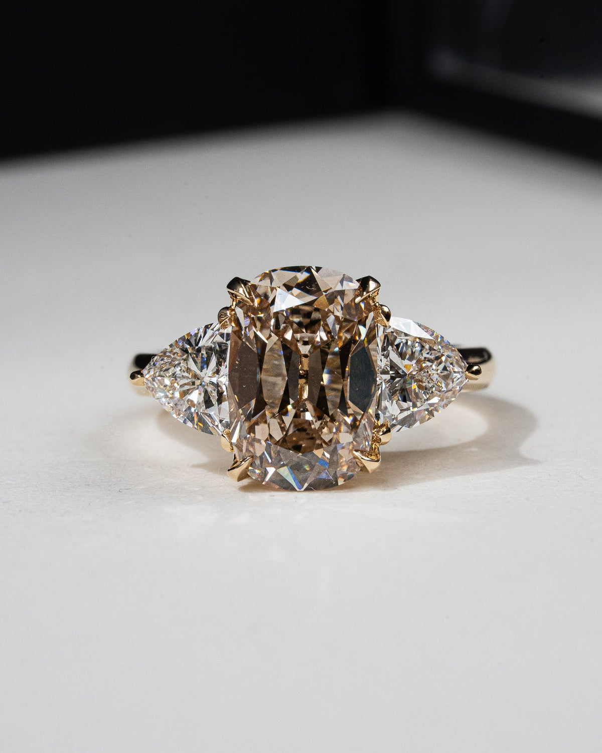 Old mine cut champagne trilogy engagement ring