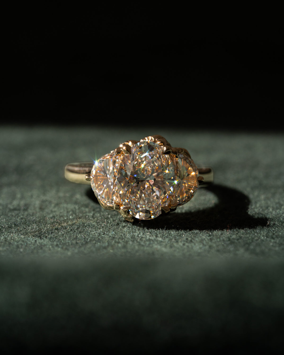 Oval diamond with half moon trilogy