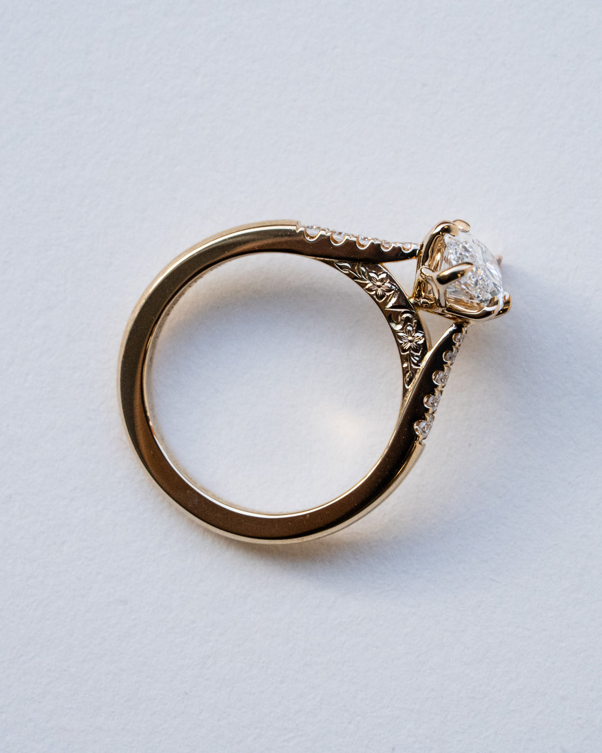 Marquise diamond with pavé shoulders and floral engraving